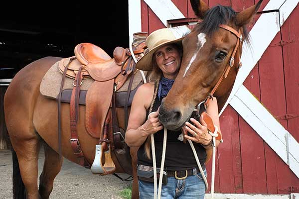 Augie with a dressage saddle